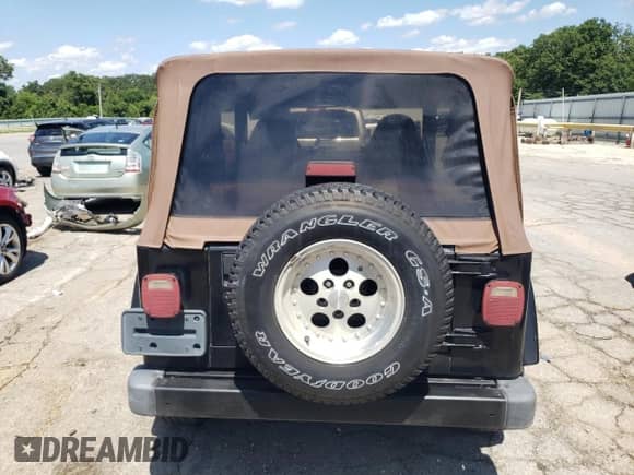 1999 Jeep Wrangler Sahara с VIN 1J4FY49S6XP432277, выставлен на аукционе Copart как лот 61622585 с пробегом 113 390 миль миль и Списание • Salvage title. История ставок и продаж доступна на DreamBid. Изображение 6.