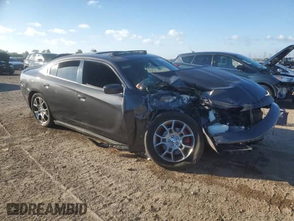 2015 Dodge Charger SXT with VIN 2C3CDXJG3FH742701, listed as a Copart auction lot 71244325 with Not provided miles and Salvage title. Bid and sale history available at DreamBid. Image 4.
