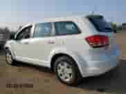 2012 Dodge Journey American Value with VIN 3C4PDCAB1CT306684, listed as a Copart auction lot 80072875 with 134,927 mi miles and Salvage title. Bid and sale history available at DreamBid. Image 2.