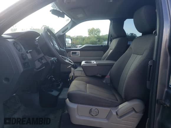 2009 Ford F-150 STX with VIN 1FTRX14W79FB26020, listed as a Copart auction lot 71348725 with 130,749 mi miles and Salvage title. Bid and sale history available at DreamBid. Image 7.