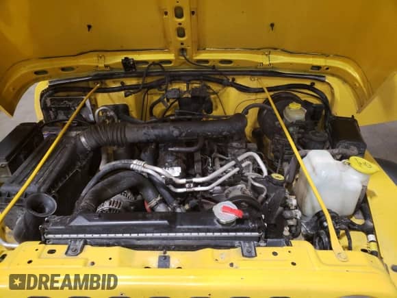 2000 Jeep Wrangler Sport z VIN 1J4FA49S7YP735946, wystawiony jako Copart lot #68370665 z przebiegiem 201 407 mil mil oraz Szkoda całkowita • Salvage title. Historia ofert i sprzedaży dostępna na DreamBid. Obrazek 11.