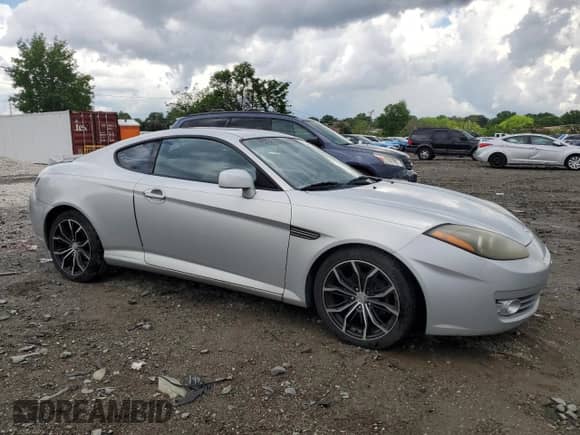 2008 Hyundai Tiburon GT с VIN KMHHN66F48U270030, выставлен на аукционе Copart как лот 55349275 с пробегом 205 068 миль миль и Списание • Salvage title. История ставок и продаж доступна на DreamBid. Изображение 4.