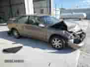 1999 Toyota Camry LE z VIN JT2BF28K2X0219943, wystawiony jako Copart lot #70005325 z przebiegiem Nie podano mil oraz Szkoda całkowita • Salvage title. Historia ofert i sprzedaży dostępna na DreamBid. Obrazek 4.