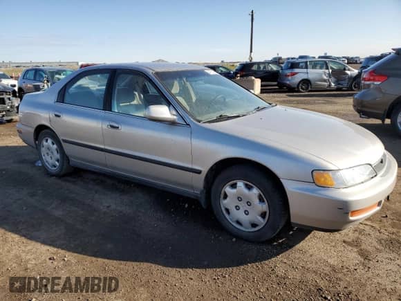 1997 Honda Accord LX with VIN 1HGCD5630VA809341, listed as a Copart auction lot 54182105 with 223,707 mi miles and Salvage title. Bid and sale history available at DreamBid. Image 4.