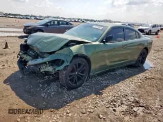 2018 Dodge Charger SXT z VIN 2C3CDXBG5JH167265, wystawiony jako Copart lot #71434065 z przebiegiem 96 707 mil mil oraz Szkoda całkowita • Salvage title. Historia ofert i sprzedaży dostępna na DreamBid. Obrazek 1.