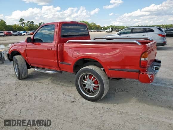2004 Toyota Tacoma PreRunner with VIN 5TENM92N74Z464206, listed as a Copart auction lot 84038115 with 217,428 mi miles and Salvage title. Bid and sale history available at DreamBid. Image 2.