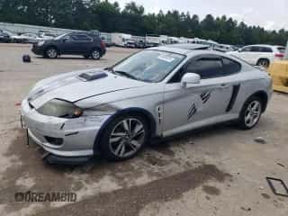 2006 Hyundai Tiburon GS с VIN KMHHM65D66U226482, выставлен на аукционе Copart как лот 64059334 с пробегом 93 932 миль миль и Списание • Salvage title. История ставок и продаж доступна на DreamBid. Изображение 1.