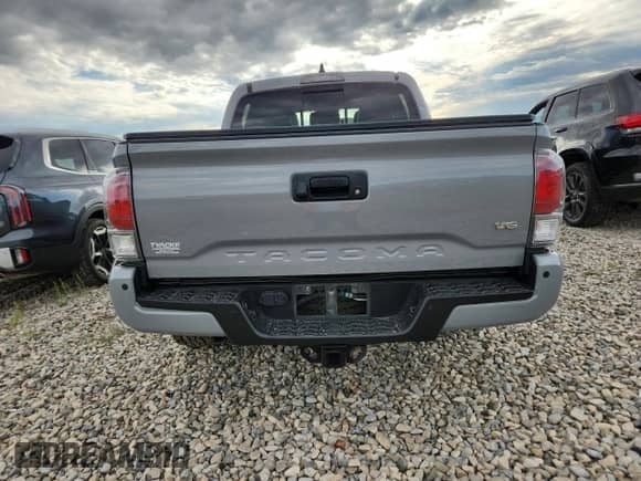 2021 Toyota Tacoma SR с VIN 3TYCZ5AN7MT017461, выставлен на аукционе Copart как лот 69605795 с пробегом 89 667 миль миль и Списание • Salvage title. История ставок и продаж доступна на DreamBid. Изображение 6.