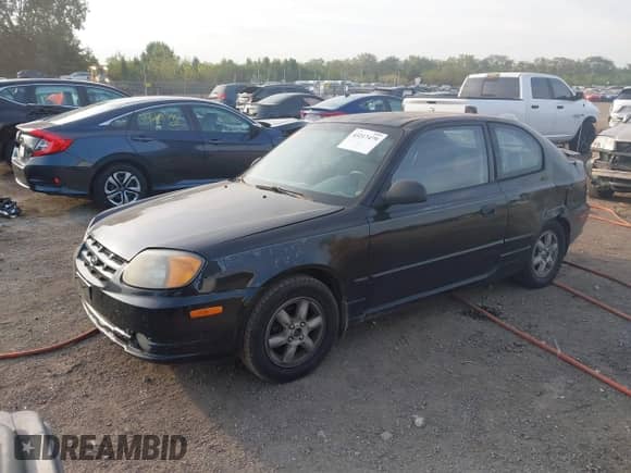 2005 Hyundai Accent GLS z VIN KMHCG35CX5U332441, wystawiony jako IAAI lot #43217479 z przebiegiem 225 254 mil mil oraz . Historia ofert i sprzedaży dostępna na DreamBid. Obrazek 17.