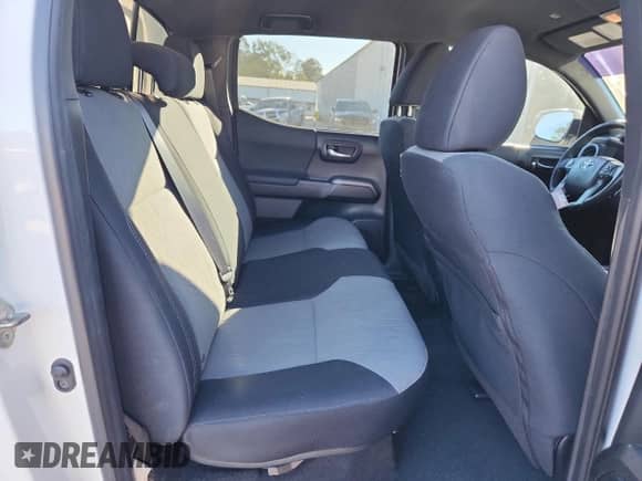 2020 Toyota Tacoma SR5 z VIN 3TMCZ5AN4LM294482, wystawiony jako Copart lot #90620945 z przebiegiem 135 293 mil mil oraz Szkoda całkowita • Salvage title. Historia ofert i sprzedaży dostępna na DreamBid. Obrazek 10.