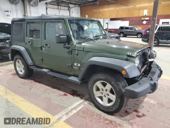 2008 Jeep Wrangler Unlimited X with VIN 1J4GA39158L583789, listed as a Copart auction lot 86292065 with 170,334 mi miles and Salvage title. Bid and sale history available at DreamBid. Image 4.