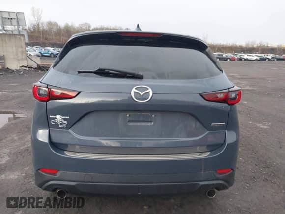 2022 Mazda CX-5 S Carbon Edition z VIN JM3KFBCM9N1538707, wystawiony jako IAAI lot #42026877 z przebiegiem 36 077 mil mil oraz . Historia ofert i sprzedaży dostępna na DreamBid. Obrazek 16.