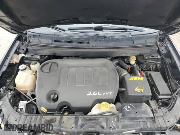 2014 Dodge Journey R/T z VIN 3C4PDCEG7ET227013, wystawiony jako Copart lot #55409384 z przebiegiem 121 859 mil mil oraz Szkoda całkowita • Salvage title. Historia ofert i sprzedaży dostępna na DreamBid. Obrazek 13.