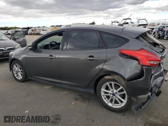 2015 Ford Focus SE with VIN 1FADP3K22FL294012, listed as a Copart auction lot 84920825 with 155,437 mi miles and Salvage title. Bid and sale history available at DreamBid. Image 2.