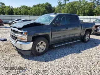 2017 Chevrolet Silverado 1500 LT with VIN 3GCPCREC1HG367137, listed as a Copart auction lot 61458385 with 141,871 mi miles and Salvage title. Bid and sale history available at DreamBid. Image 1.