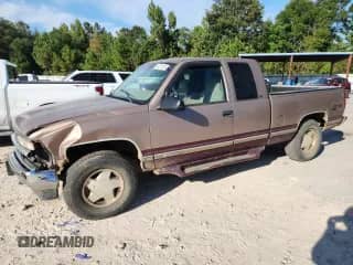 1997 Chevrolet Silverado 1500 with VIN 2GCEK19R8V1244918, listed as a Copart auction lot 84737415 with 101,436 mi miles and Salvage title. Bid and sale history available at DreamBid. Image 1.