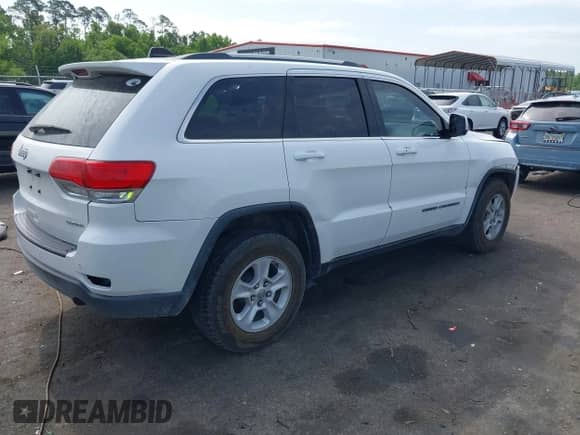 2017 Jeep Grand Cherokee Laredo with VIN 1C4RJEAG7HC929917, listed as a IAAI auction lot 42201857 with 172,560 mi miles and . Bid and sale history available at DreamBid. Image 4.