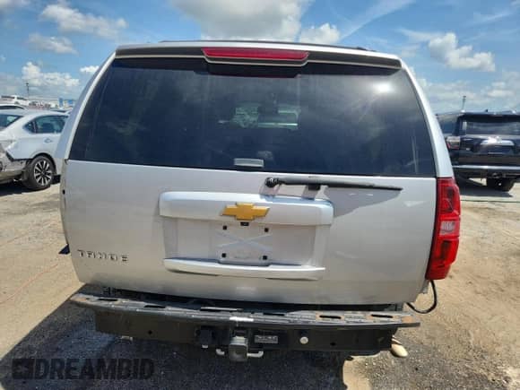 2014 Chevrolet Tahoe LT with VIN 1GNSCBE07ER135040, listed as a Copart auction lot 65328115 with 114,497 mi miles and Salvage title. Bid and sale history available at DreamBid. Image 6.