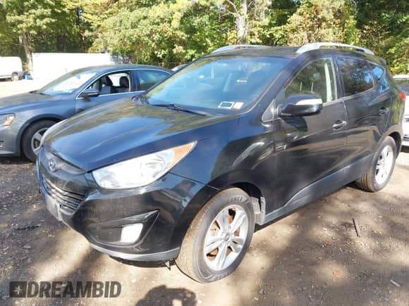 2013 Hyundai Tucson GLS with VIN KM8JUCAC3DU737576, listed as a IAAI auction lot 43373425 with 99,785 mi miles and . Bid and sale history available at DreamBid. Image 2.