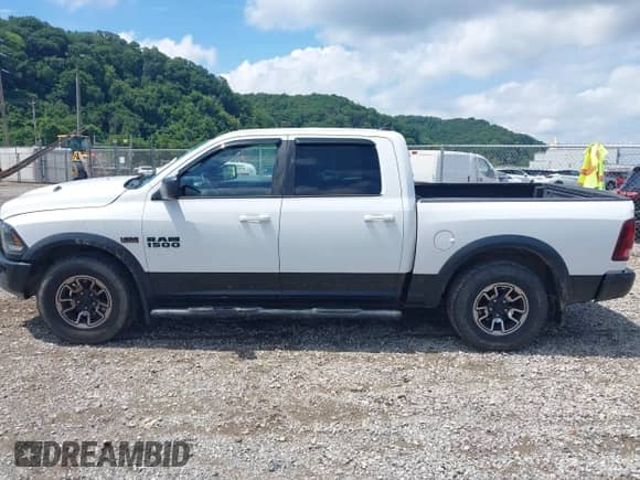 2015 Ram 1500 Rebel with VIN 1C6RR7YT0FS751169, listed as a IAAI auction lot 42689218 with 101,431 mi miles and . Bid and sale history available at DreamBid. Image 14.