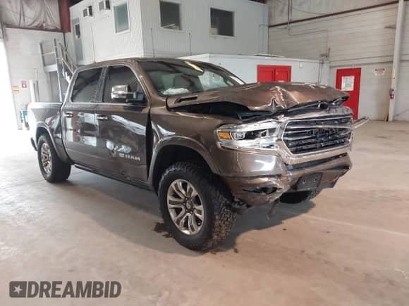 2020 Ram 1500 Longhorn with VIN 1C6SRFKT1LN275397, listed as a IAAI auction lot 42733634 with 101,019 mi miles and . Bid and sale history available at DreamBid. Image 1.