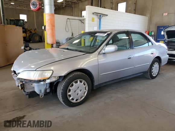 2002 Honda Accord LX с VIN 1HGCG564X2A064108, выставлен на аукционе Copart как лот 61826185 с пробегом 228 317 миль миль и Списание • Salvage title. История ставок и продаж доступна на DreamBid. Изображение 1.