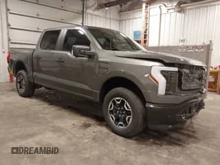 2023 Ford F-150 Lightning Pro with VIN 1FTVW1EL8PWG15920, listed as a IAAI auction lot 43185861 with 18,750 mi miles and . Bid and sale history available at DreamBid. Image 1.