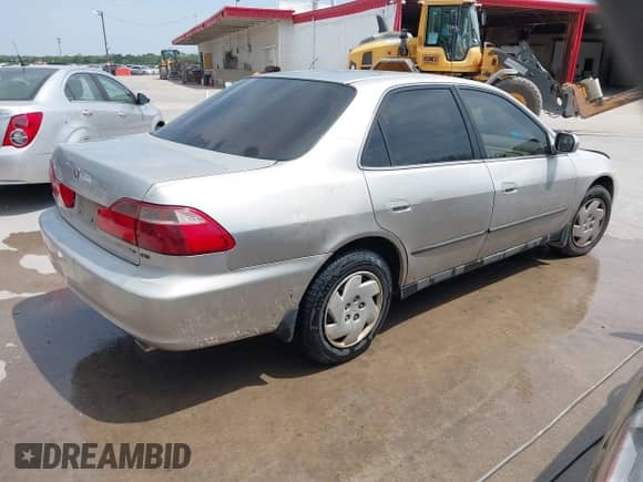 1999 Honda Accord LX with VIN 1HGCG1649XA057733, listed as a IAAI auction lot 42069269 with 296,882 mi miles and . Bid and sale history available at DreamBid. Image 4.