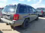 2002 Jeep Grand Cherokee Laredo with VIN 1J4GW48S22C109789, listed as a IAAI auction lot 43241658 with 229,235 mi miles and . Bid and sale history available at DreamBid. Image 4.