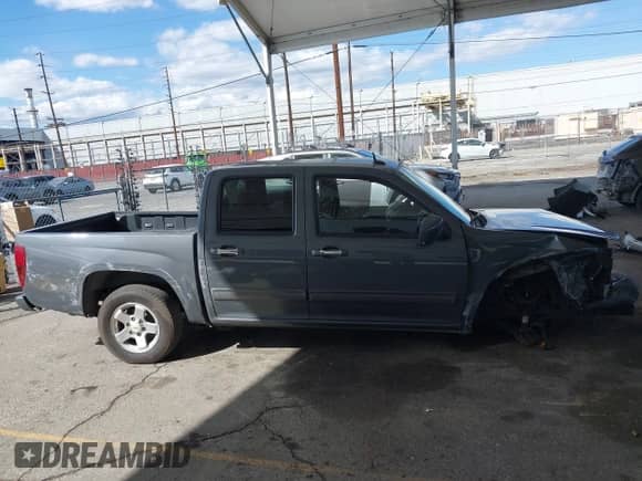 2012 Chevrolet Colorado 1LT z VIN 1GCDSCF90C8157374, wystawiony jako IAAI lot #41701631 z przebiegiem 128 202 mil mil oraz . Historia ofert i sprzedaży dostępna na DreamBid. Obrazek 13.