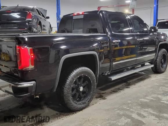 2018 GMC Sierra 1500 SLT with VIN 3GTU2NEC0JG182906, listed as a Copart auction lot 86178095 with 119,084 mi miles and Clean title. Bid and sale history available at DreamBid. Image 4.