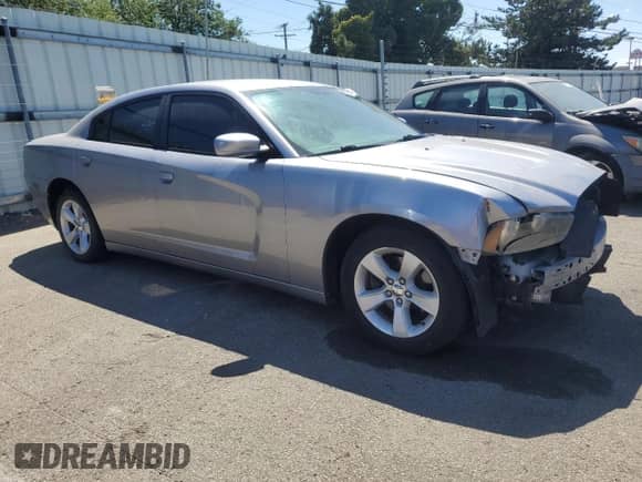 2014 Dodge Charger SE with VIN 2C3CDXBG4EH130116, listed as a Copart auction lot 69834515 with 128,661 mi miles and Salvage title. Bid and sale history available at DreamBid. Image 4.