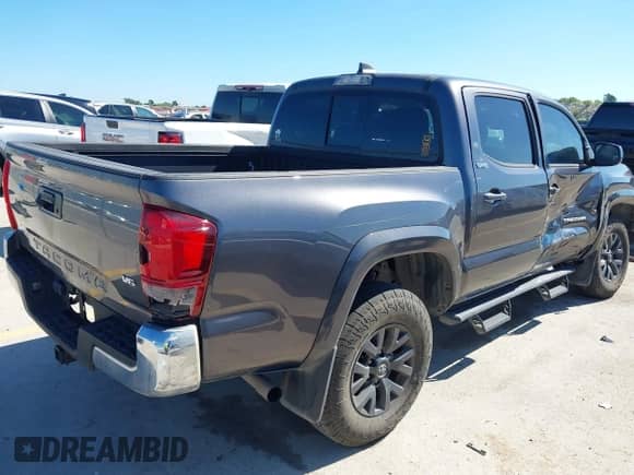 2021 Toyota Tacoma SR5 with VIN 5TFAZ5CN0MX106119, listed as a IAAI auction lot 42812735 with 70,968 mi miles and . Bid and sale history available at DreamBid. Image 4.