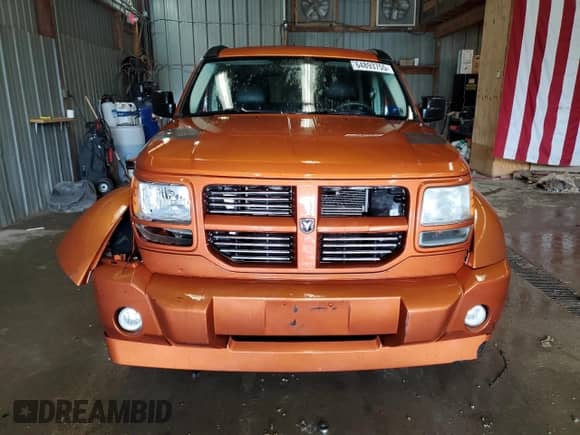 2011 Dodge Nitro Shock z VIN 1D4PU7GX8BW590952, wystawiony jako Copart lot #64893755 z przebiegiem 135 449 mil mil oraz Szkoda całkowita • Salvage title. Historia ofert i sprzedaży dostępna na DreamBid. Obrazek 5.