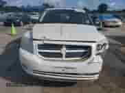 2008 Dodge Caliber SXT with VIN 1B3HB48C48D590860, listed as a Copart auction lot 54125585 with 242,177 mi miles and Salvage title. Bid and sale history available at DreamBid. Image 5.