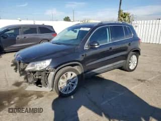 2010 Volkswagen Tiguan with VIN WVGBV9AX0AW527380, listed as a Copart auction lot 87064144 with 129,547 mi miles and Salvage title. Bid and sale history available at DreamBid. Image 1.