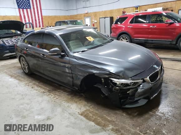 2015 BMW 4 Series 435i xDrive with VIN WBA4B3C59FGV48547, listed as a Copart auction lot 61742324 with Not provided miles and Salvage title. Bid and sale history available at DreamBid. Image 4.