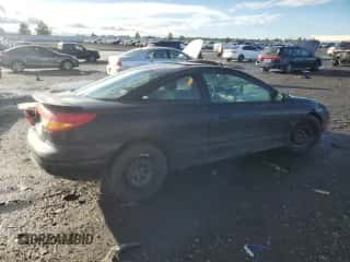 2000 Saturn SC с VIN 1G8ZY1273YZ152453, выставлен на аукционе Copart как лот 84834784 с пробегом Не указан миль и Списание • Salvage title. История ставок и продаж доступна на DreamBid. Изображение 3.