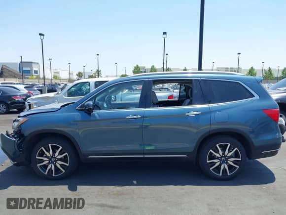 2021 Honda Pilot Touring 7-Passenger z VIN 5FNYF5H63MB039129, wystawiony jako IAAI lot #42455224 z przebiegiem Nie podano mil oraz . Historia ofert i sprzedaży dostępna na DreamBid. Obrazek 13.