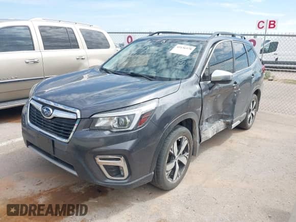 2020 Subaru Forester Touring with VIN JF2SKAXCXLH603473, listed as a IAAI auction lot 43136578 with 61,456 mi miles and . Bid and sale history available at DreamBid. Image 2.