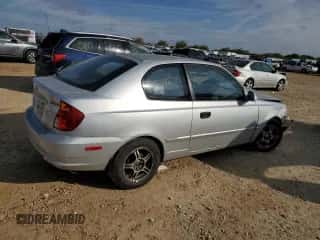 2004 Hyundai Accent GL с VIN KMHCG35C94U292013, выставлен на аукционе Copart как лот 84253364 с пробегом Не указан миль и Списание • Salvage title. История ставок и продаж доступна на DreamBid. Изображение 3.
