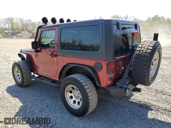2012 Jeep Wrangler Sport with VIN 1C4AJWAG7CL105511, listed as a Copart auction lot 54671835 with 137,362 mi miles and Clean title. Bid and sale history available at DreamBid. Image 2.