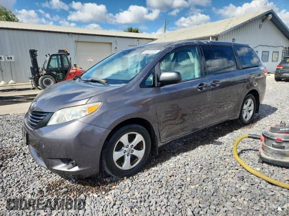 2012 Toyota Sienna with VIN 5TDZK3DCXCS233781, listed as a Copart auction lot 82167325 with 183,332 mi miles and Salvage title. Bid and sale history available at DreamBid. Image 1.