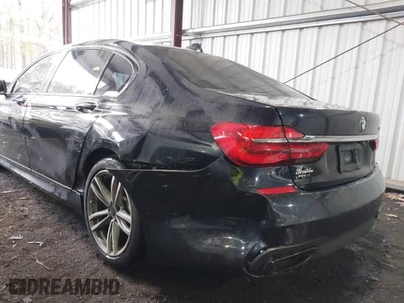 2016 BMW 7 Series 750i xDrive with VIN WBA7F2C50GG418511, listed as a IAAI auction lot 41695547 with 98,858 mi miles and . Bid and sale history available at DreamBid. Image 6.