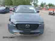 2025 Mazda CX-5 S Carbon Edition z VIN JM3KFBCM0S0678727, wystawiony jako IAAI lot #43111665 z przebiegiem 6 866 mil mil oraz . Historia ofert i sprzedaży dostępna na DreamBid. Obrazek 12.
