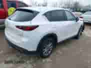 2023 Mazda CX-5 S Carbon Edition z VIN JM3KFBCM8P0187510, wystawiony jako IAAI lot #42628848 z przebiegiem 42 972 mil mil oraz . Historia ofert i sprzedaży dostępna na DreamBid. Obrazek 4.