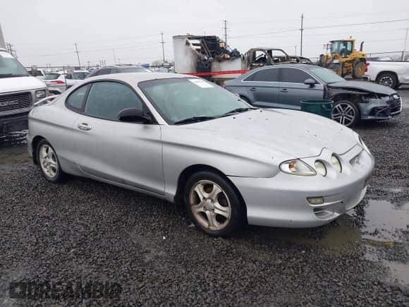 2001 Hyundai Tiburon с VIN KMHJG25F81U267658, выставлен на аукционе IAAI как лот 41092438 с пробегом 188 575 миль миль и . История ставок и продаж доступна на DreamBid. Изображение 1.
