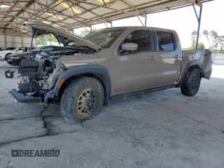 2023 Nissan Frontier Pro-4X with VIN 1N6ED1EK7PN642235, listed as a Copart auction lot 62079635 with 70,733 mi miles and Salvage title. Bid and sale history available at DreamBid. Image 1.
