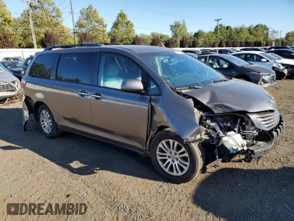 2017 Toyota Sienna XLE with VIN 5TDYZ3DC0HS798507, listed as a Copart auction lot 80711385 with 144,731 mi miles and Salvage title. Bid and sale history available at DreamBid. Image 4.