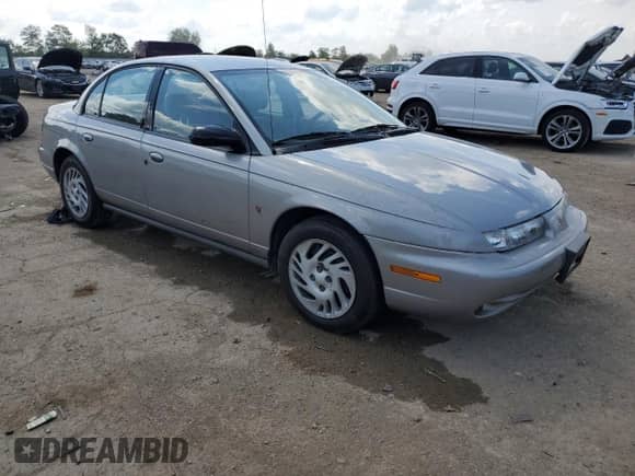 1999 Saturn SL z VIN 1G8ZK5277XZ306928, wystawiony jako Copart lot #63299615 z przebiegiem 42 474 mil mil oraz Szkoda całkowita • Salvage title. Historia ofert i sprzedaży dostępna na DreamBid. Obrazek 4.